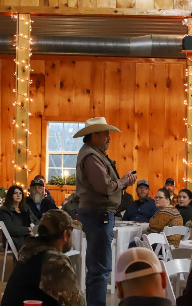 Man presenting to room full of people