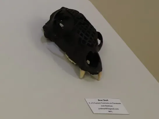 Honorable mention winning piece, Bear Skull (right), created by Josh Redman.