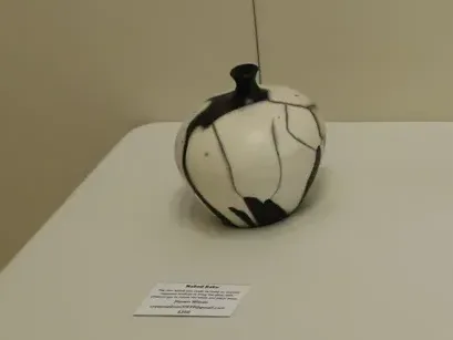 Second place winning piece, Naked Raku (bottom left), created by Steven Wilson.