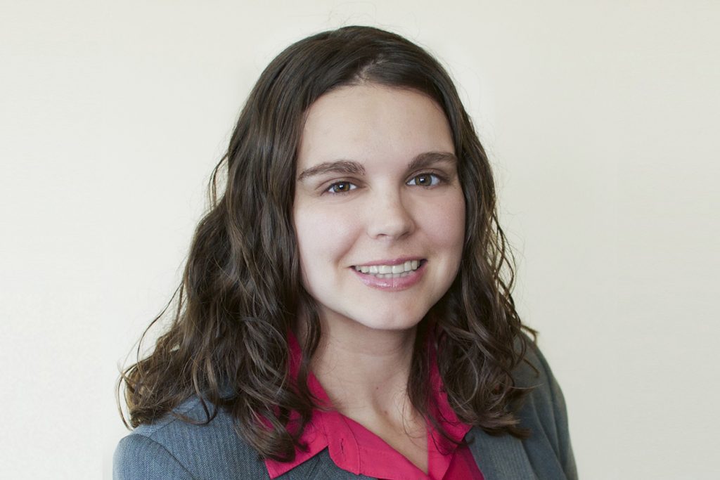 Portrait of a woman with long, dark hair.
