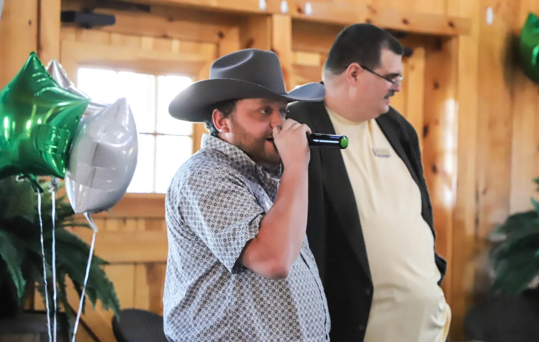 Auctioneer Michael Thomas solicits bids to help fund scholarships at the college.