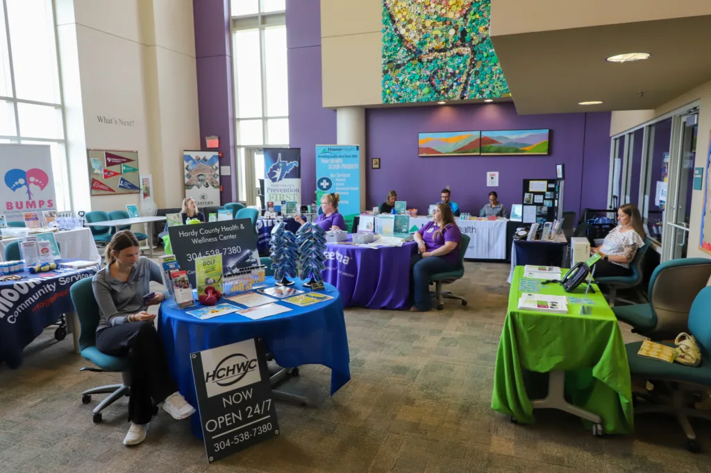 People sitting at multiple tables for their organizations