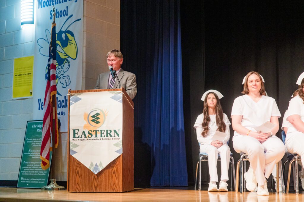 Photo of Dr. Thomas Striplin speaking at podium.